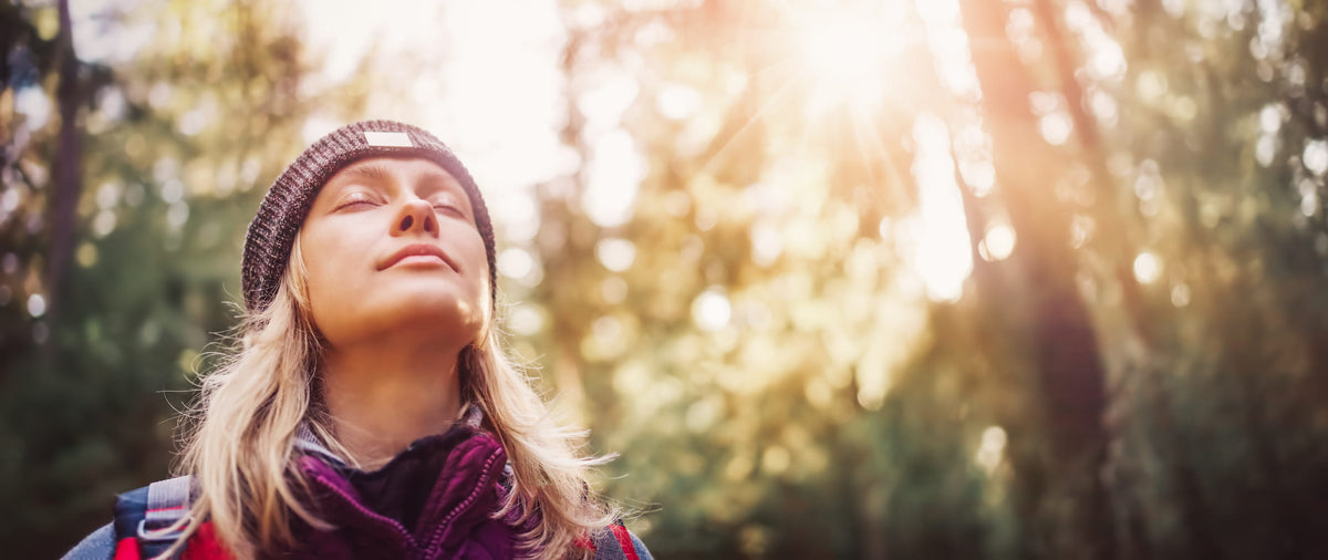 Woman walking outside in forest